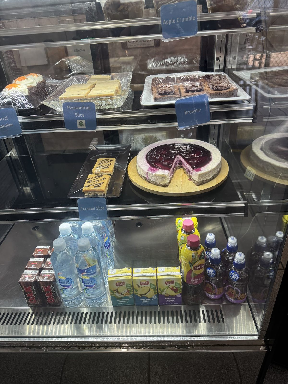 The dessert cabinet with blueberry cheesecake, passionfruit slice, caramel slice and brownies